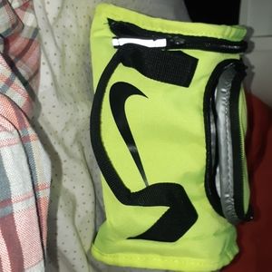 A neon yellow nike lunch bag